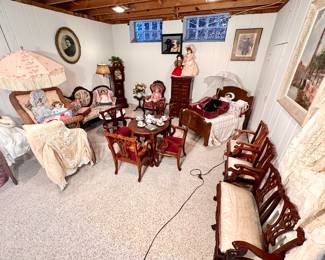 A room full of child size furniture, some antiques.