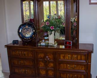 Intricate wooden dresser with mirror