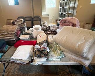 Variety of sheets, towels, sheers, quilts, blankets, and more