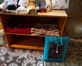 Linens  Placemats, quilt with bag for storage and two open shelving units for sale