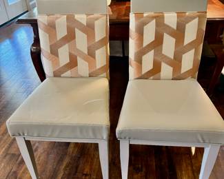 Pair of chairs shown with desk