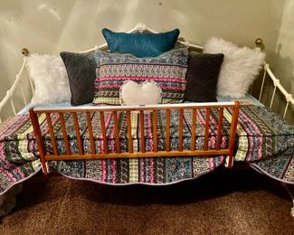 Iron day bed shown with wood trundle