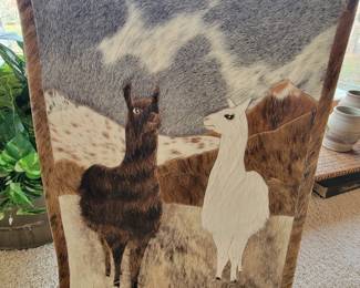 This piece of art is made from leather and animal hair