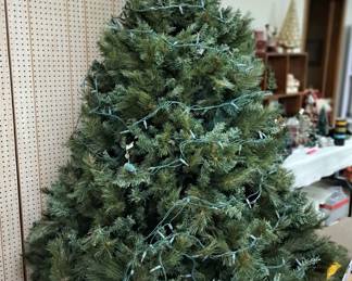 Large selection of lighted and unlighted Christmas trees and wreaths 