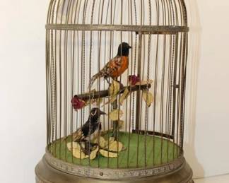 Antique French Animated Singing Birds in Cage it has 2 Birds that alternate singing while they move their Beaks, Heads and Tail Feathers. 20" tall &11" wide, Brass Dome shape wire cage. In good working condition. Weight: 7.5 lbs.  with Orginial key. 