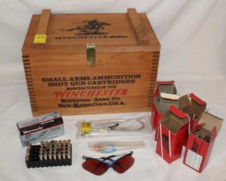 Wooden Winchester Ammo Case Wooden ammo crate with 104 empty .38 special cases, 55 empty 45 Long Colt cases, 15 empty .357 cases,  a partial box of 32 .357 magnum and 4 .38 Special rounds of ammunition, and a set of shooting glasses.