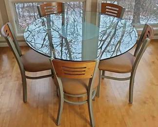 Contemporary Glass And Metal Pedestal Table With 5 Metal And Wood Chairs. n n n