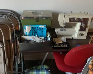Sewing machine and table folding table