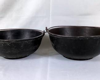 BIHY205 Antique Cast Iron Round Scotch Bowls	Dated back to the 1850's, both have working handles with gate marks #3 & #4. Both do have wear to them

