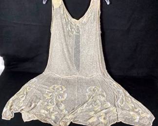 BIHY206 1920’s Glass Bead Flapper Dress	Very fragile, looks like some attempts & repairs have been made. Strings of glass beads and sequence throughout the dress. By the shoulders and neckline are where some of the beading is coming apart. Measurements are in the photos.

