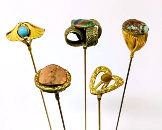 BIHY210 Victorian Art Nouveau Hat Pins	5 different kind of hat pins. A couple of the pins have gemstones. One of the pins has a stamped on it 'HHCCO' as shown in the picture.
