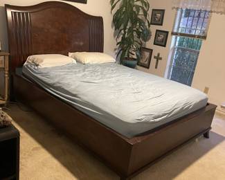 Beautyrest adjustable queen bed on a burled walnut checkerboard inlay headboard.