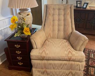 Button tufted armchair in neutrals. Side table with magazine holder and storage.  
