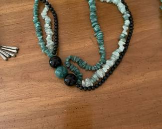 Multi-media beaded necklace finished with a silver clasp