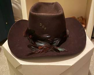 Women's brown felt cowboy hat with feather accents