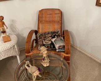 WIcker chair with footstool. Also glass top wicker coffee table.