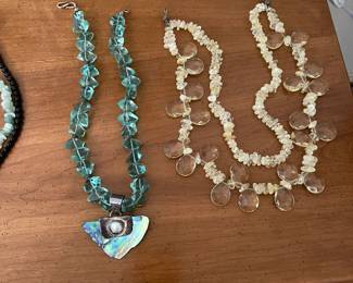 Turquoise, silver and opal necklace with silver clasp. Milky and clear beaded necklace with silver clasp.