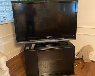 46" Samsung TV on stereo stand with shelf