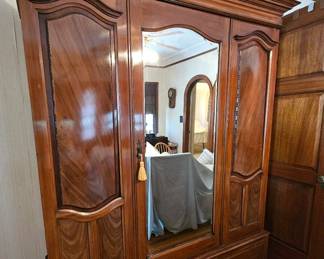 Armoire/ Wardrobe with two generous drawers and a beveled mirror, guaranteed to smile back at you!