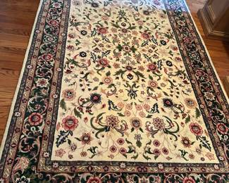 Ivory Kashan rug with heavy floral motif