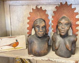 small painting of pheasant and African sculpture pair