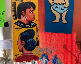 Ghana barbershop painting and an Al Weidenbacher in back.  Hiram Ed Taylor' Mardi Gras float in foreground