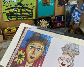 Small paintings and prints on paper; In background, Huey P. Long Bridge by Al Weidenbacher, Tiki by Mike Hoff