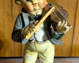 Vintage boy playing violin 