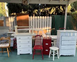 This picture shows a few chairs, a pair of dressers, a file cabinet, alongside the chairs and a white stool.  Come on by to see the other items.