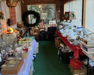These tables contain a smorgasbord of dishware, holiday items, and other furnishings.
