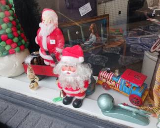 Vintage Christmas decorations. 1950s strato mechanical Bank rocket ship
