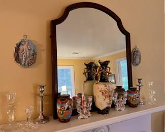 Living Room | The mantel features a beautiful European handled vase with cobalt and gold detailing and a hand-painted floral bouquet on both sides, a pair of figural porcelain two-light candlesticks, a pair of hand-painted Japanese vases, and several miscellaneous crystal and metal candlesticks.
