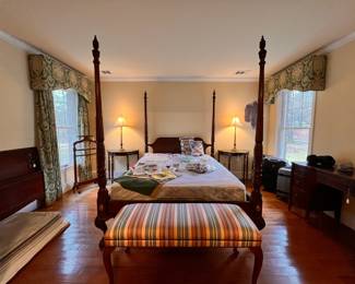 Bedroom 1 | View of Queen Anne bed, a pair of demi-lune side tables, and other furnishings.