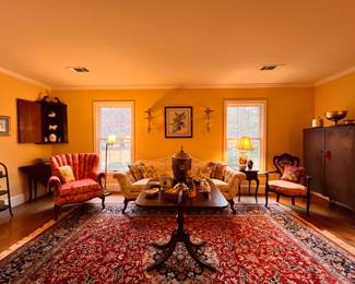 Living Room | Features an antique Victorian Pullman sofa, an 8.5'x12' Colonial Williamsburg reproduction area rug, a 19th-century mahogany corner cabinet, and many more noteworthy items.