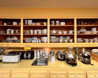 Kitchen | Entire wall of fine china sets and individual pieces.