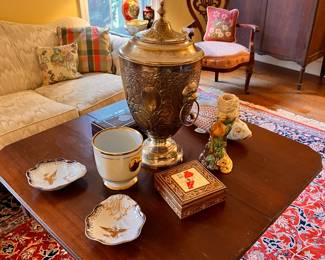 Living Room | On the mahogany tea/card table, you will find several decorative porcelain pieces and other miscellaneous decor, which is certain to add a touch of elegance to any room.