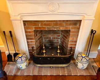 Living Room | The fireplace features a fine pair of solid brass andirons, an antique brass fender, 4 iron fire tools, and a large pair of colorful floral porcelain lidded jars.
