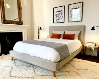 upholstered queen bed, various art, rugs, lamps, mirror