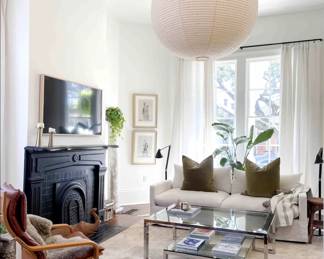 sofa, pillows, coffee table, drapes and rods, rug. leather chairs/lantern/TV NFS, art and vintage column TBD