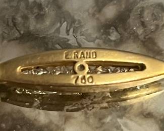 Signature and 18K stamp of 750