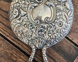 Young ladies sterling Repousse hand mirror 