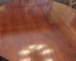 Gorgeous antique round table in planked walnut!  Stunning inset four legged base.  French…