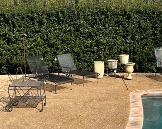Old 1940s wide loungers with iron wheels and recently powder coated 