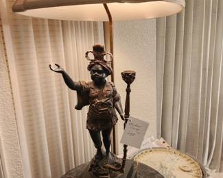 Unusual lamp with brass figurine