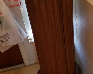 Umbrella stand style tall wooden piece. Marble top. It has Shelf inside so I used for liquor/wine.