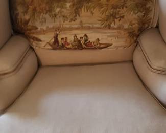 Unusual chair with pinkish/rose fabric. Printed fabric removable. Has unusual footstool in next pix.