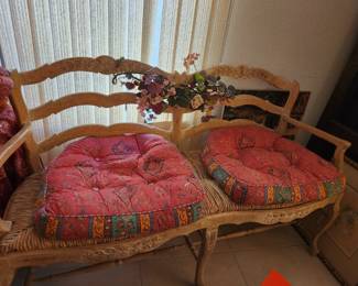 Unusual settee. Light colored wood.