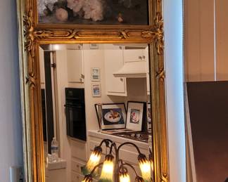 Large hand carved 22kt gold leaf mirror with original flower oil painting.