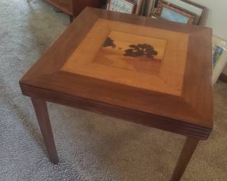 Beautiful inlaid folding table that could be hung as art until needed.