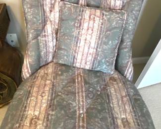 There are two of the armless sitting chairs